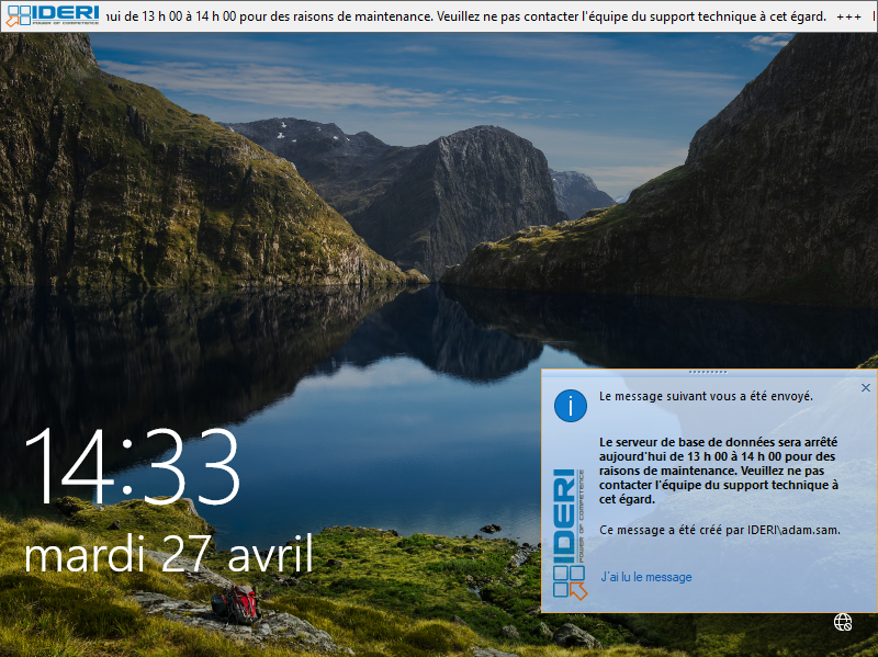 L'écran de verrouillage de Windows® 10 affichant une fenêtre de message et la bannière défilante